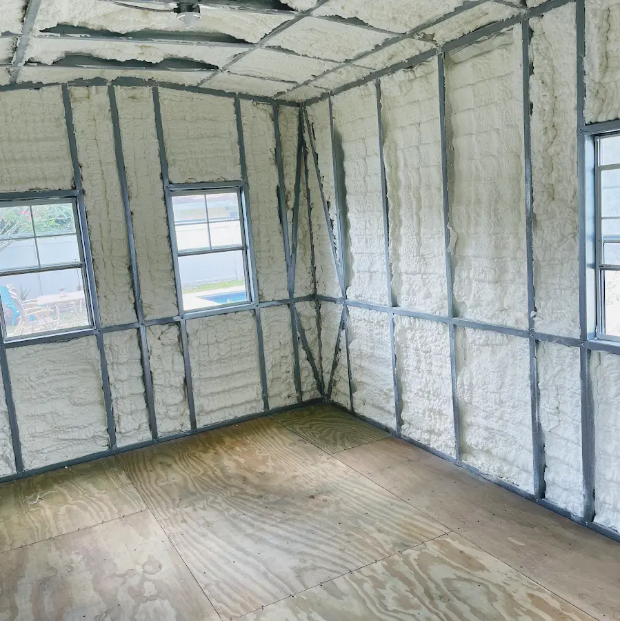 Closed-cell spray foam insulation applied to wall cavities in a residential project in Ayer